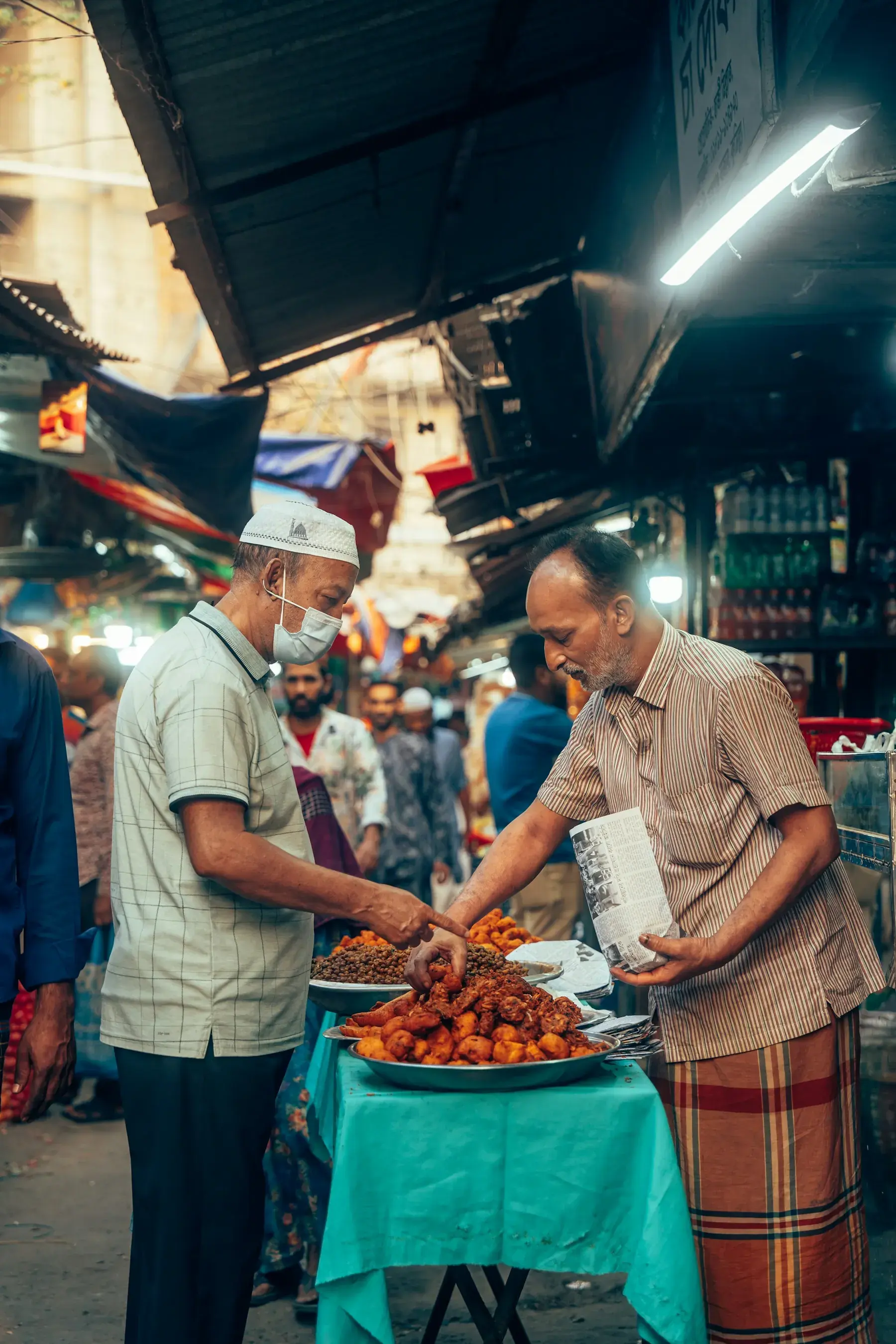 Food sellers serving customers in Chawkbazar