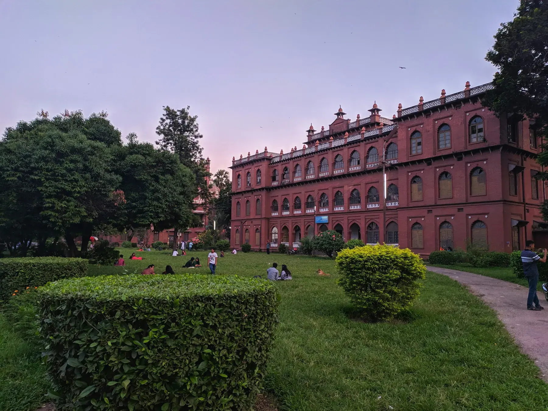 Curzon Hall's red façade behind its garden