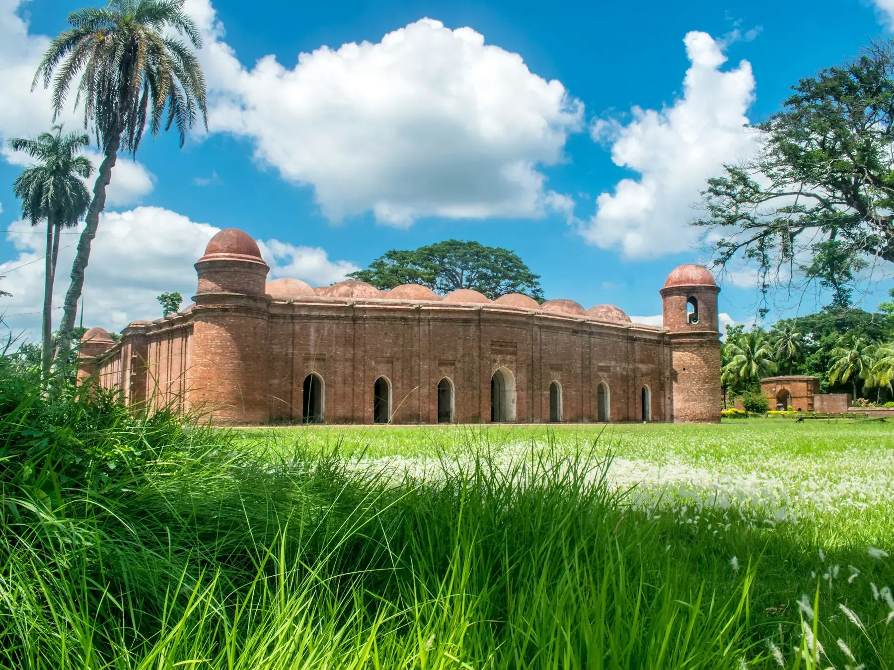 The brick and domed form of a Bengal Sultanate mosque