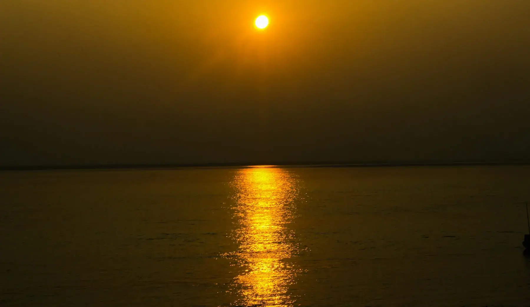 The sun reflected across the Padma River