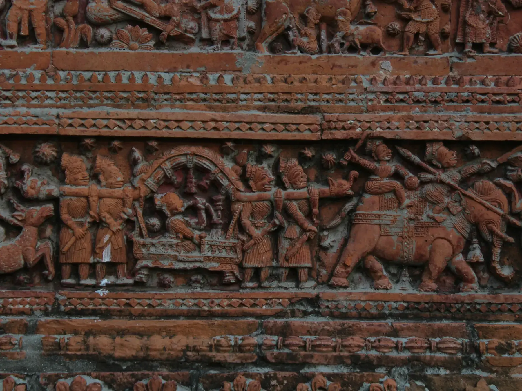 A close view of narrative terracotta temple panels