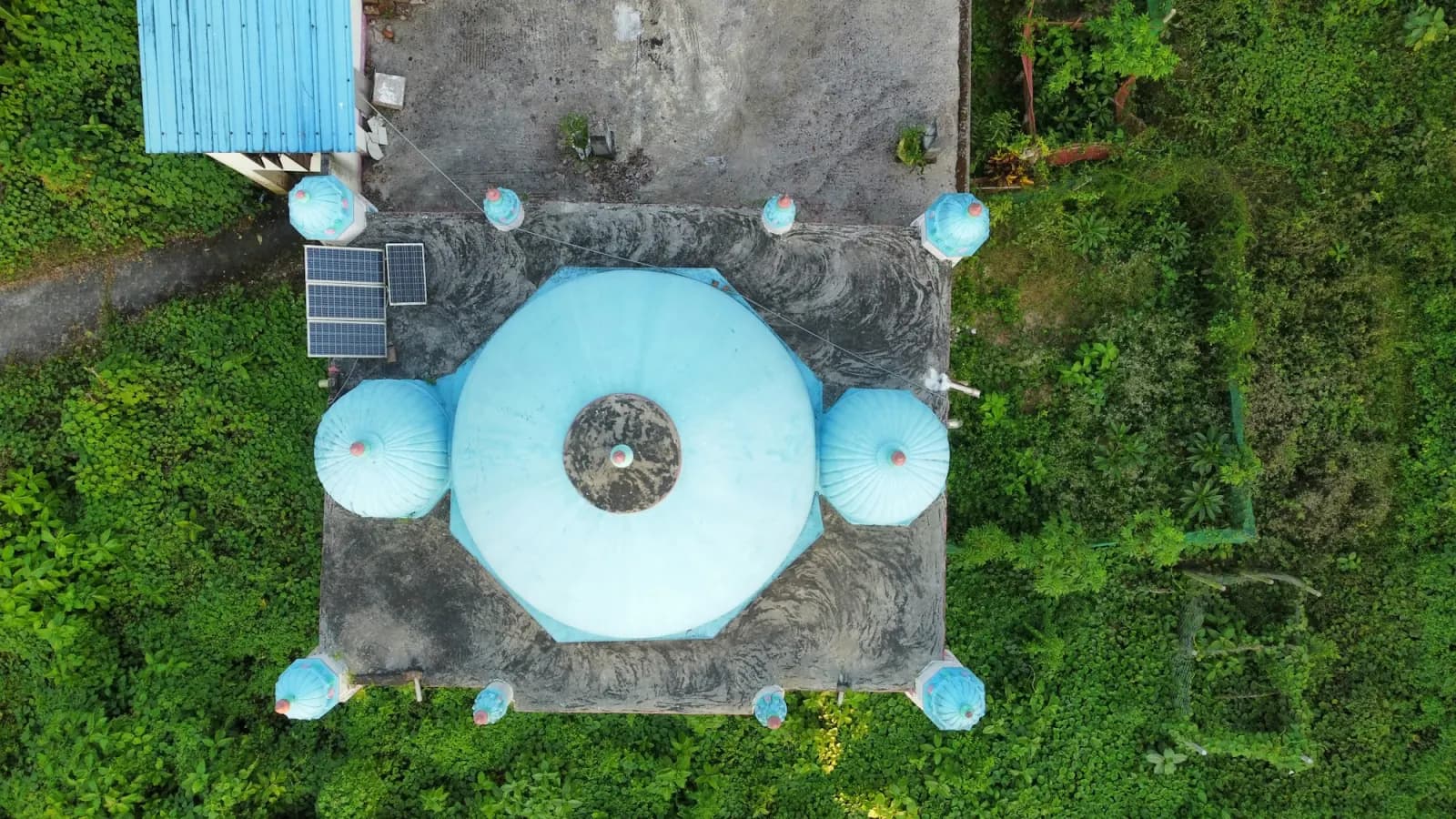 Aerial view of a historic three-domed mosque in Chattogram, regional travel context for Goaldi Mosque