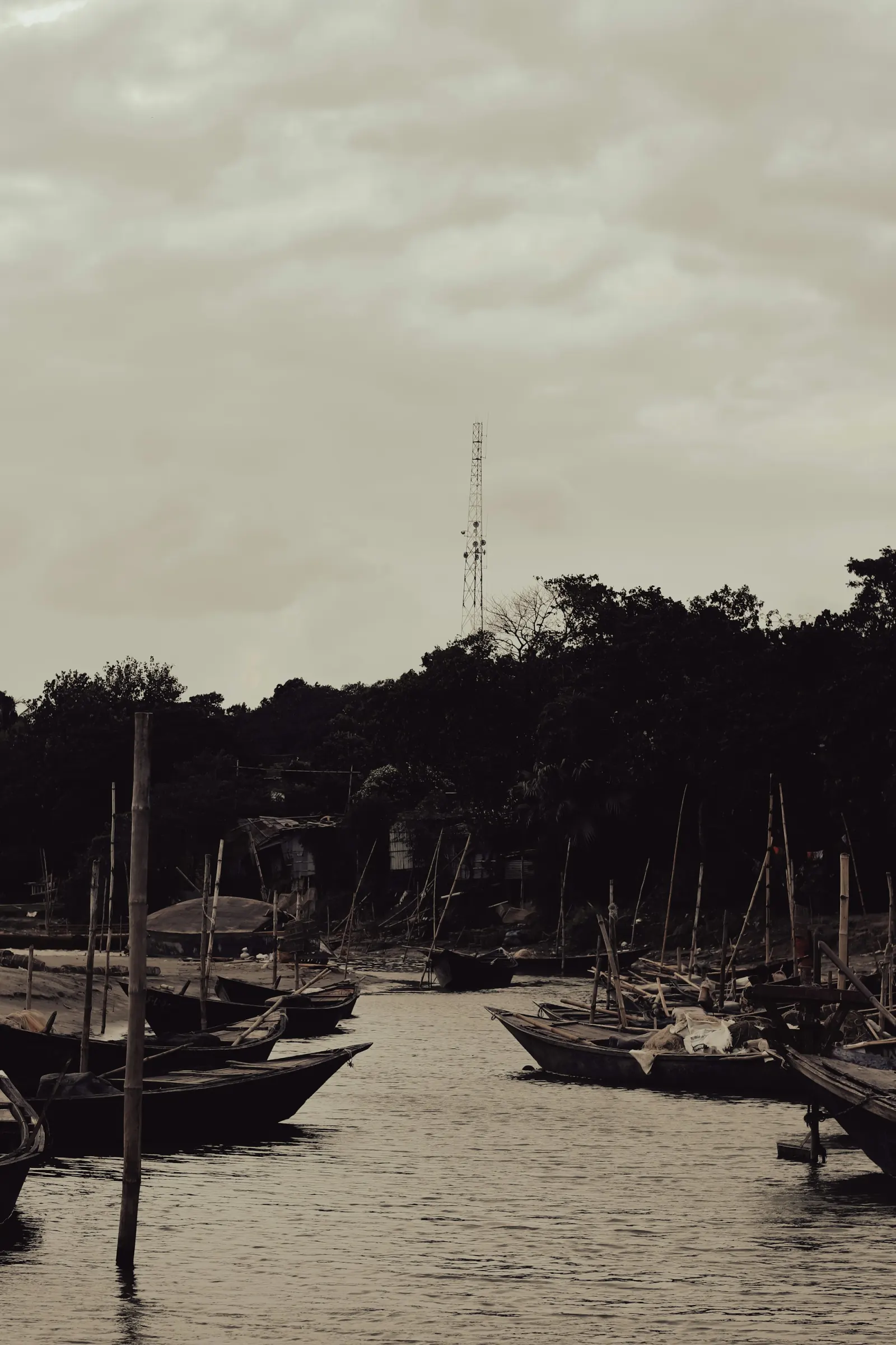 Traditional boats gathered on the Padma River at Rajshahi, regional travel context for Padma Riverfront