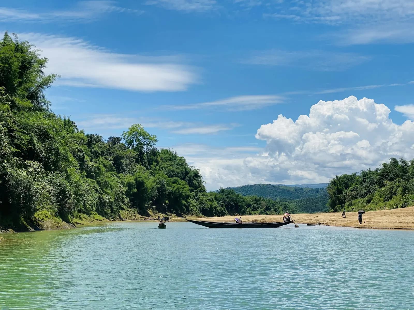 Passengers crossing a river by boat in Sylhet, Bangladesh during the Barishal River & Floating Market Tour